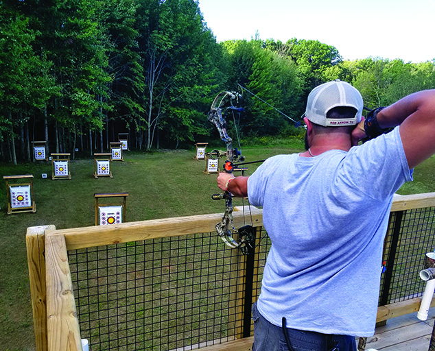 Archery range at Hidden Lake - bow - arrow - trees photo by Meredith Nicoletti